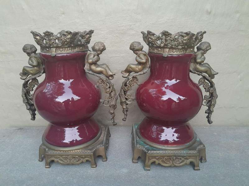 A Pair Of French Decorative Porcelain Cherub & Ormolu Urns