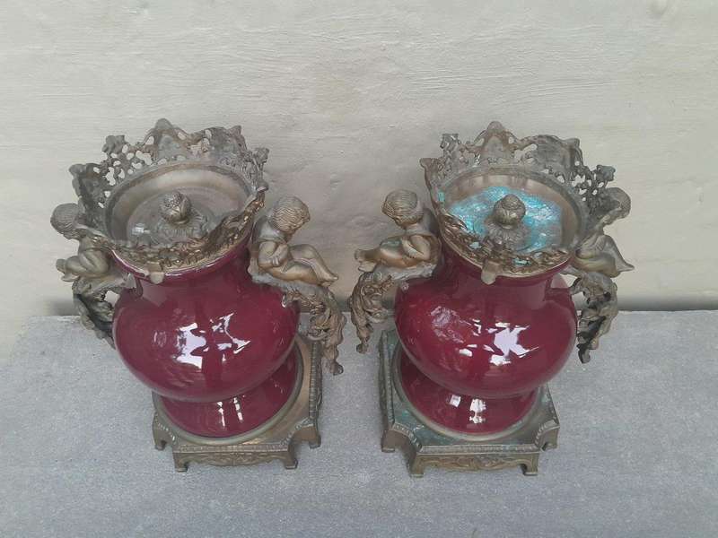 A Pair Of French Decorative Porcelain Cherub & Ormolu Urns