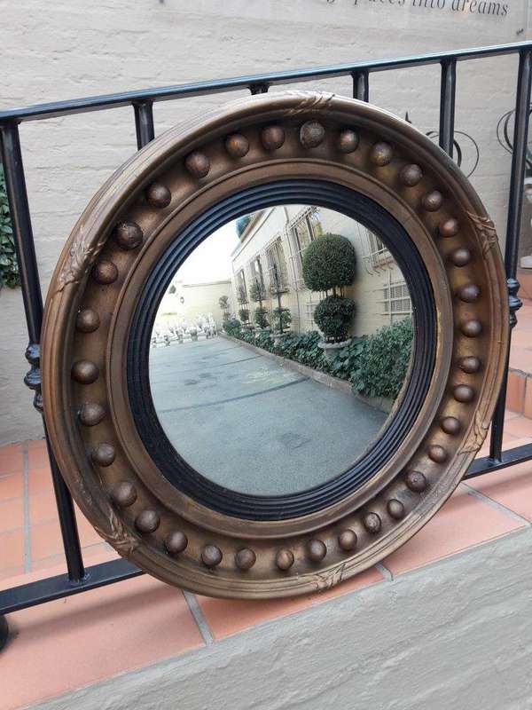 An Antique Gilt-Wood Convex Mirror