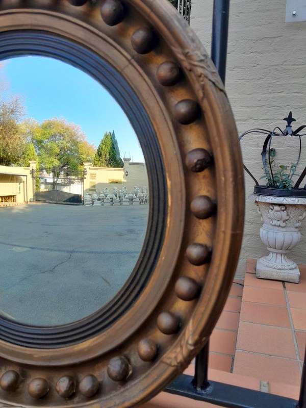 An Antique Gilt-Wood Convex Mirror