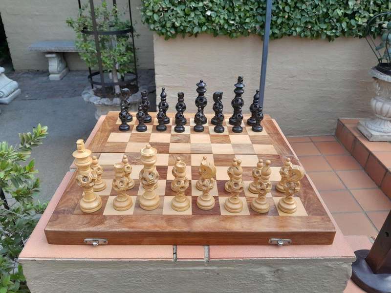A 20th Century Wooden Chess Board with Mystery Ball Pieces