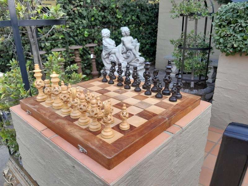 A 20th Century Wooden Chess Board with Mystery Ball Pieces