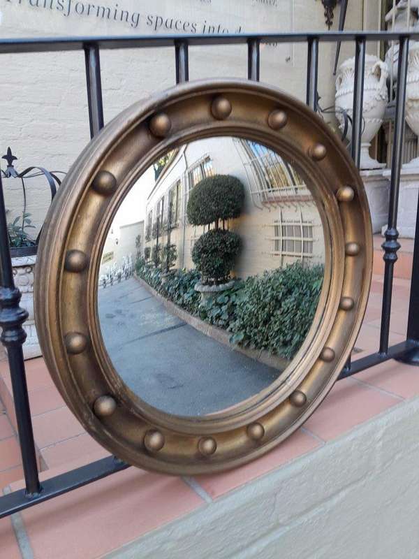 A 20th Century Regency Style Gilt Painted Convex Mirror