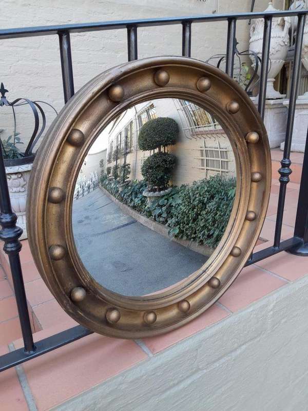A 20th Century Regency Style Gilt Painted Convex Mirror
