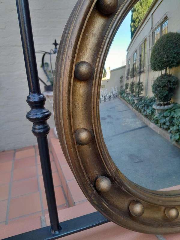 A 20th Century Regency Style Gilt Painted Convex Mirror