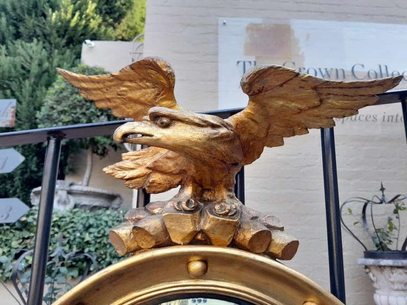 A 20TH Century Regency Style Eagle Gilt Painted Convex Mirror