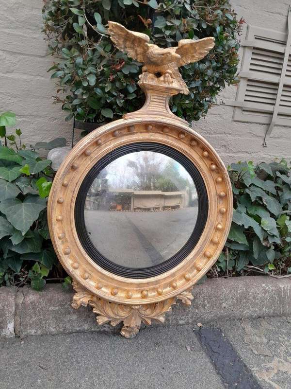 An  English Antique 19th Century Circa 1830s Regency Convex Mirror with Eagle and Ball Detail
