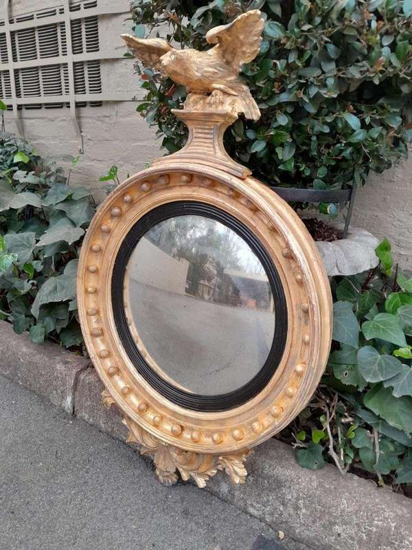 An  English Antique 19th Century Circa 1830s Regency Convex Mirror with Eagle and Ball Detail
