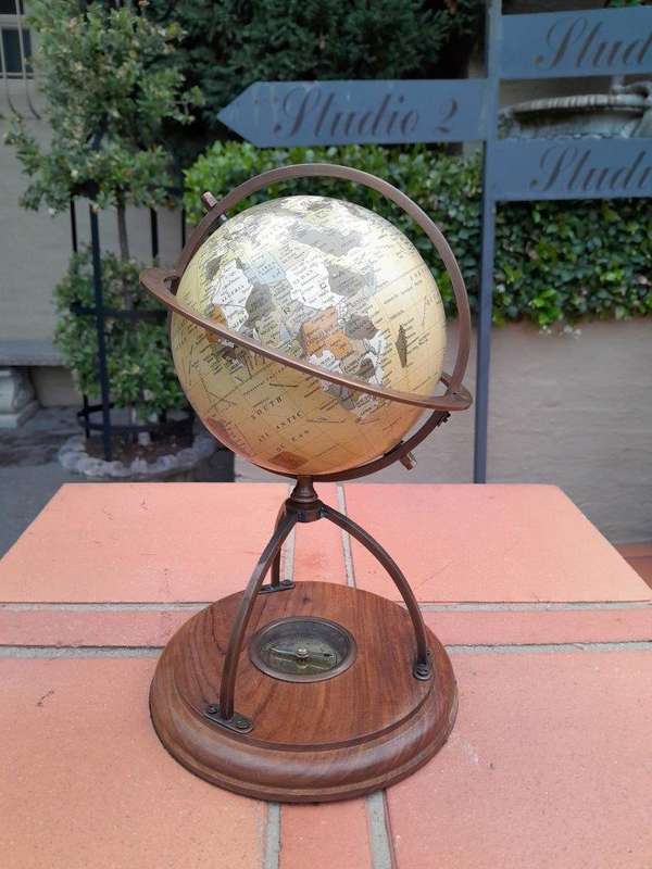 A 20th Century Library Rotating Globe with Brass Mounts and on Wooden Base with Compass