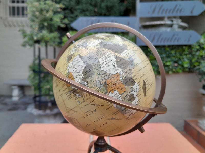 A 20th Century Library Rotating Globe with Brass Mounts and on Wooden Base with Compass