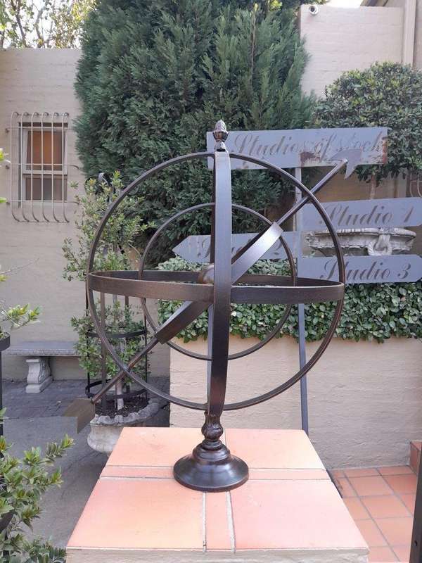 A Decorative Wrought Iron Armillary Sphere in a Antique Brown Finish