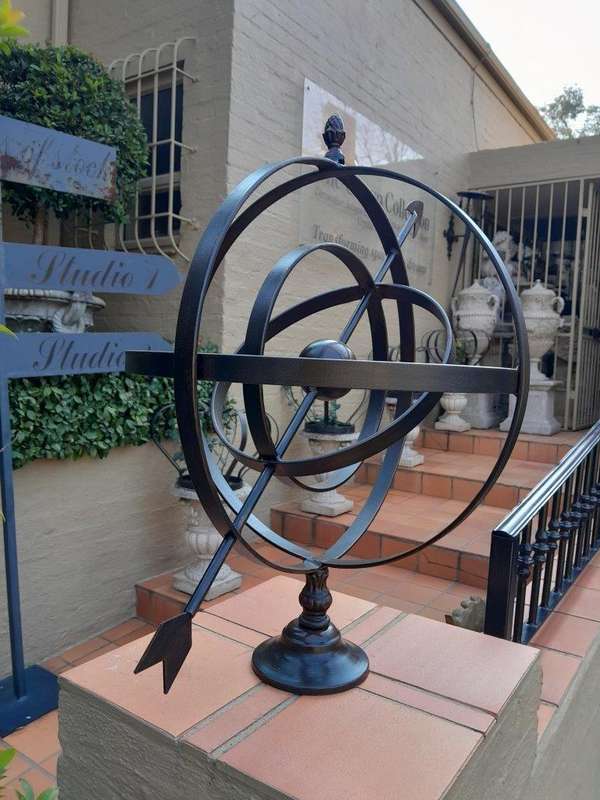 A Decorative Wrought Iron Armillary Sphere in a Antique Brown Finish