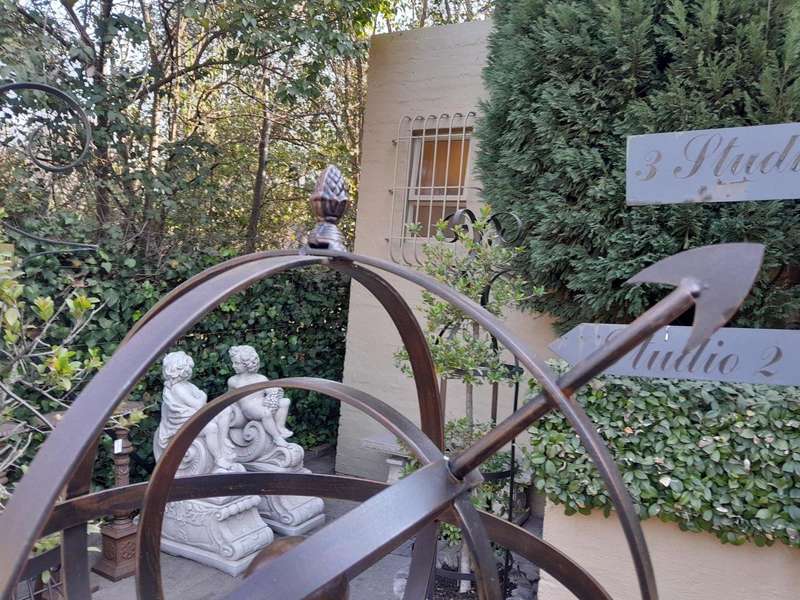 A Decorative Wrought Iron Armillary Sphere in a Antique Brown Finish