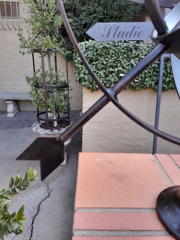 A Decorative Wrought Iron Armillary Sphere in a Antique Brown Finish