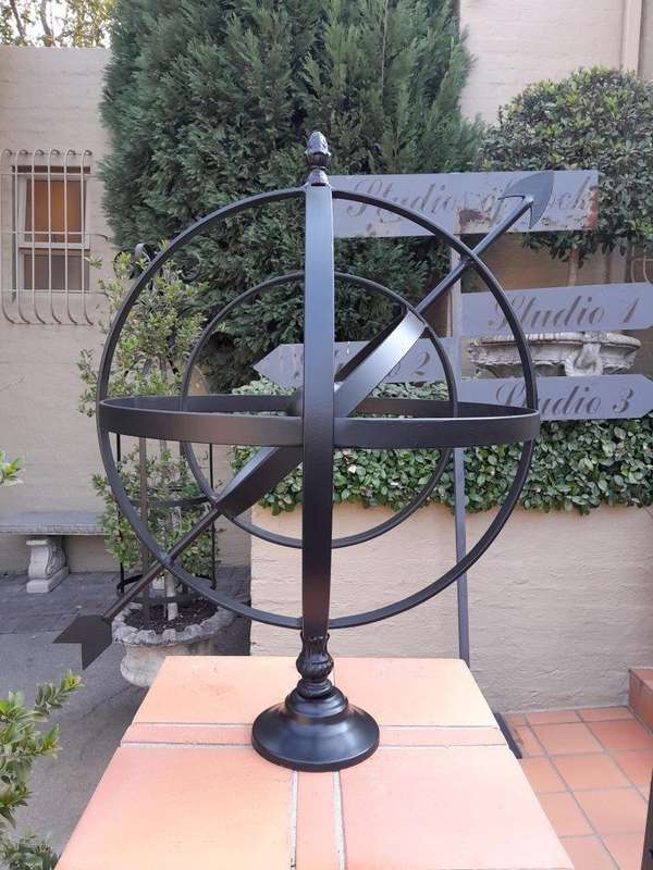 A Decorative Wrought Iron Armillary Sphere in a  Black Finish