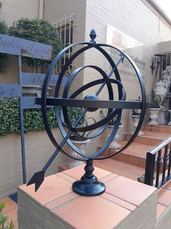 A Decorative Wrought Iron Armillary Sphere in a  Black Finish