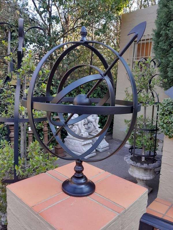 A Decorative Wrought Iron Armillary Sphere in a  Black Finish