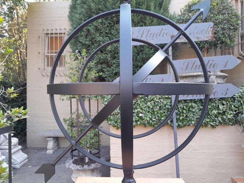 A Decorative Wrought Iron Armillary Sphere in a  Black Finish