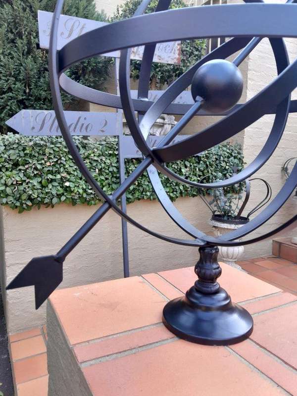 A Decorative Wrought Iron Armillary Sphere in a  Black Finish