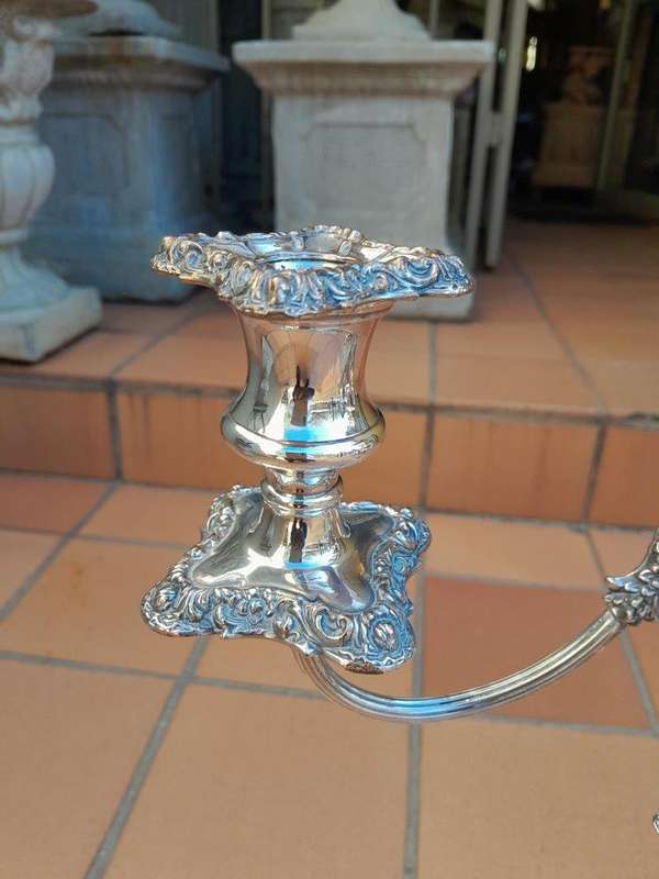 A 20TH Century Pair Of Silver-Plate Candelabras Of Large Proportions