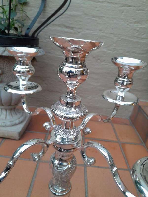 A 20TH Century Pair of Five Arm Candelabras