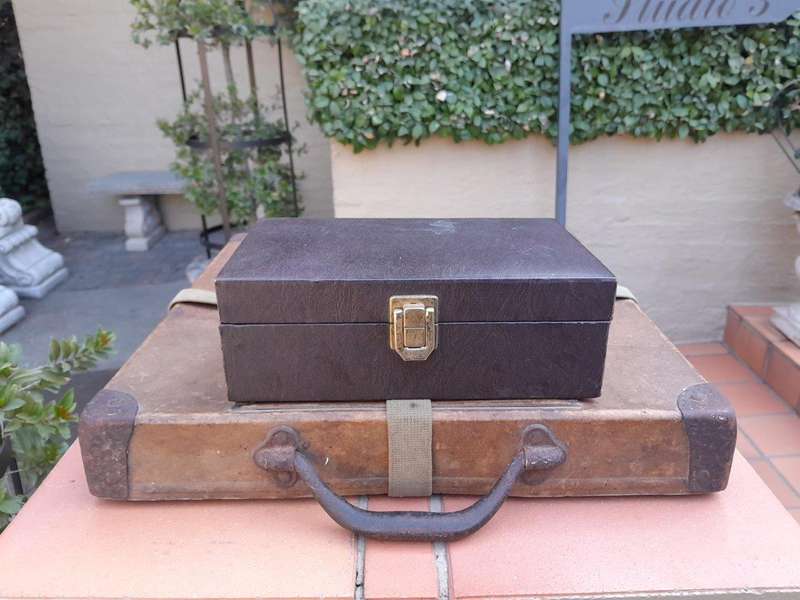 A 20th Century Hand Carved Ebony And Ivory Chess Set With Board And Leather Case