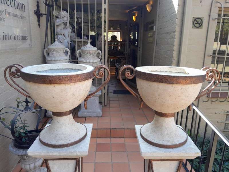 A 20th Century Decorative Pair Of Metal And Stone Urns On Stands