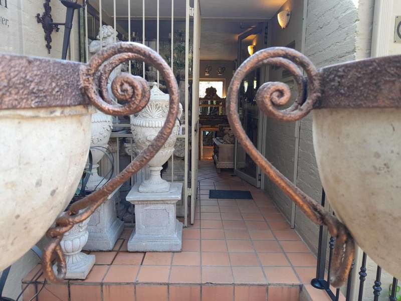 A 20th Century Decorative Pair Of Metal And Stone Urns On Stands