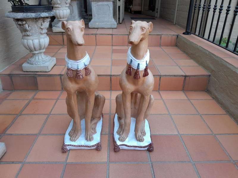 A 20th Century Pair Of Ceramic Whippets On Cushion Bases