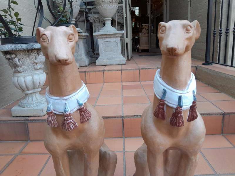 A 20th Century Pair Of Ceramic Whippets On Cushion Bases