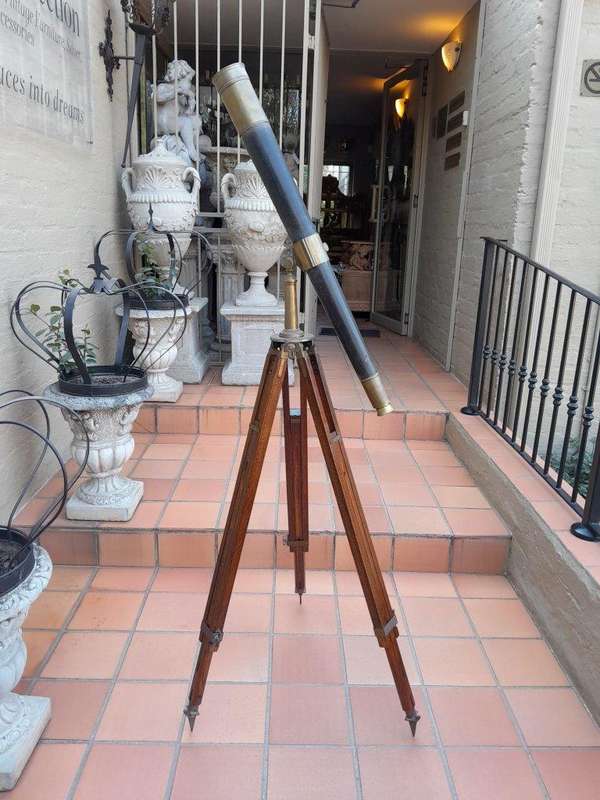 An Antique Brass And Leather Telescope On Brass And Oak Tripod Stand