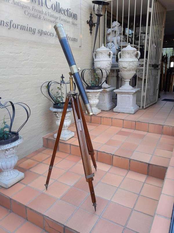 An Antique Brass And Leather Telescope On Brass And Oak Tripod Stand