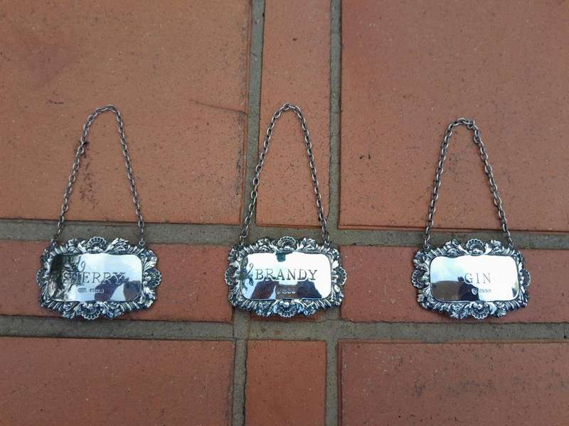 A Set of Three English Elizabeth II Silver Decanter Labels    Gin, Sherry, Brandy  Mass 41grams
