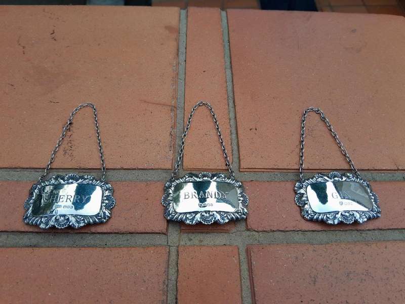 A Set of Three English Elizabeth II Silver Decanter Labels    Gin, Sherry, Brandy  Mass 41grams