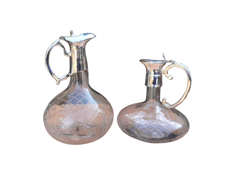 An Early 20th Century Set of Two Silver-Plated Crystal Claret Jugs