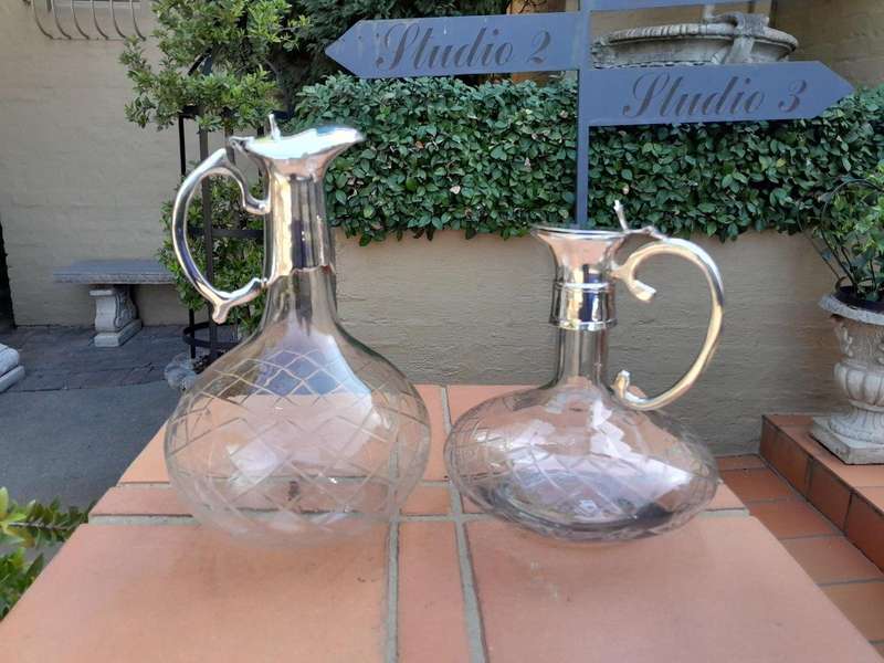 An Early 20th Century Set of Two Silver-Plated Crystal Claret Jugs