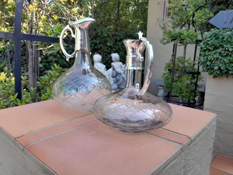 An Early 20th Century Set of Two Silver-Plated Crystal Claret Jugs