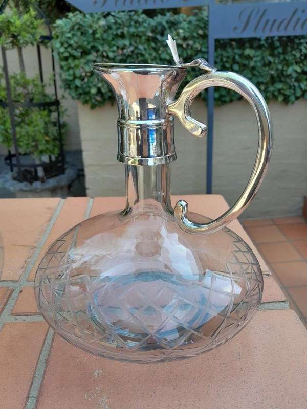 An Early 20th Century Set of Two Silver-Plated Crystal Claret Jugs