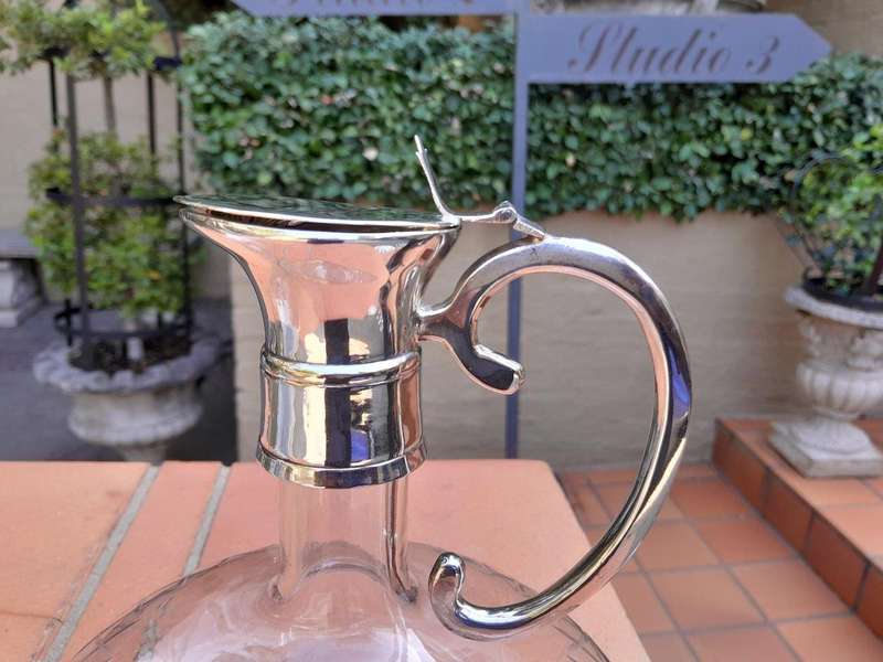 An Early 20th Century Set of Two Silver-Plated Crystal Claret Jugs