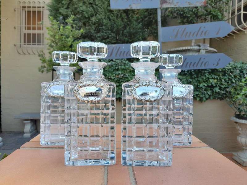 A Set of Four Decanters With Silver-plate Labels (Brandy, Scotch, Sherry, Gin)