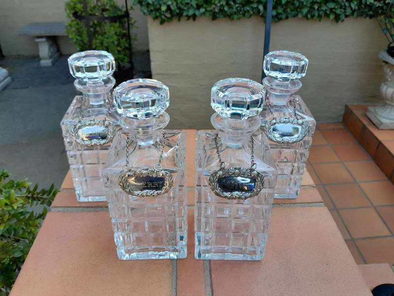 A Set of Four Decanters With Silver-plate Labels (Brandy, Scotch, Sherry, Gin)