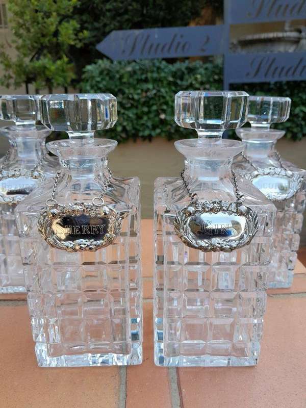 A Set of Four Decanters With Silver-plate Labels (Brandy, Scotch, Sherry, Gin)