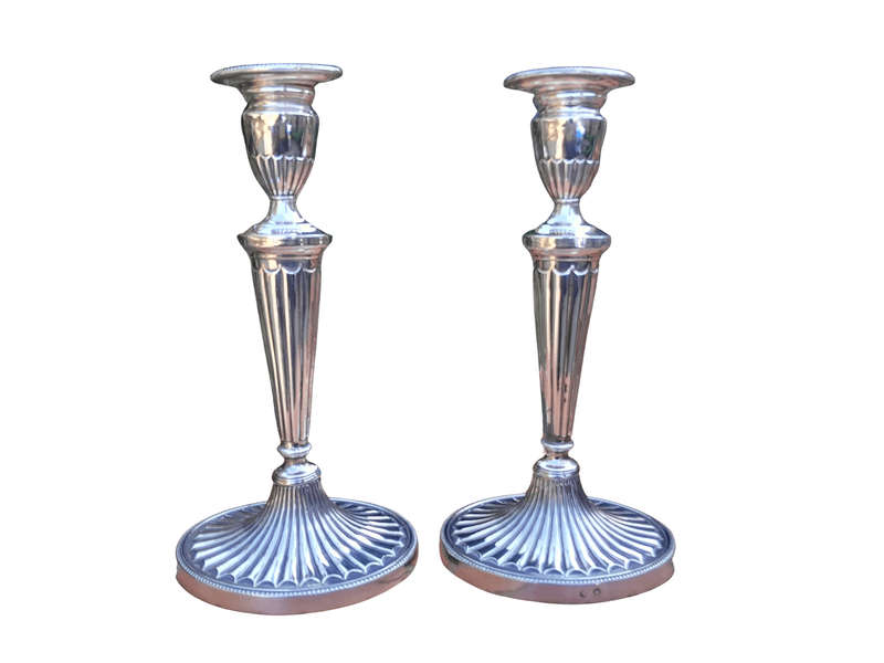 An Early 19th Century Pair of George III Old Sheffield Plated Candlesticks On Loaded Bases
