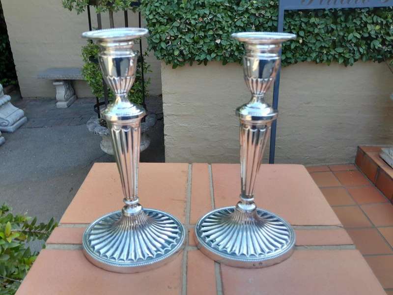 An Early 19th Century Pair of George III Old Sheffield Plated Candlesticks On Loaded Bases