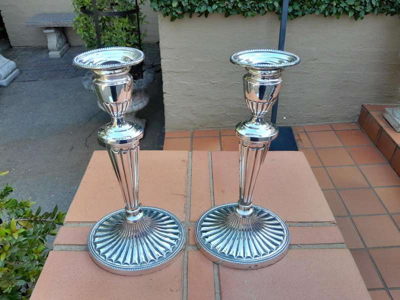 An Early 19th Century Pair of George III Old Sheffield Plated Candlesticks On Loaded Bases