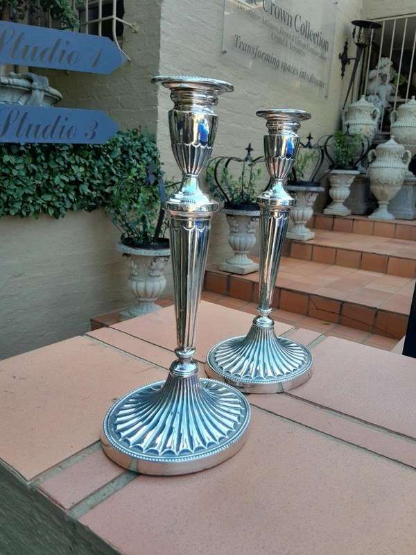 An Early 19th Century Pair of George III Old Sheffield Plated Candlesticks On Loaded Bases