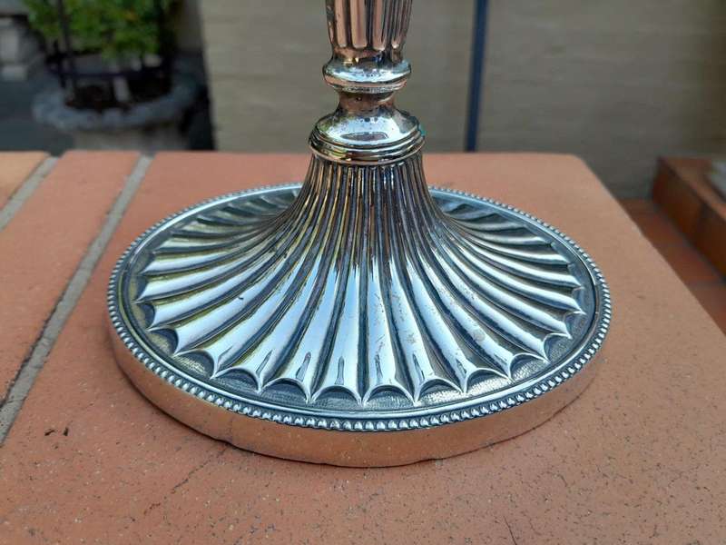 An Early 19th Century Pair of George III Old Sheffield Plated Candlesticks On Loaded Bases