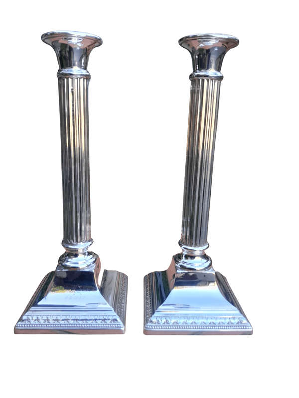 A Pair Of Silver-Plated Column Candlesticks