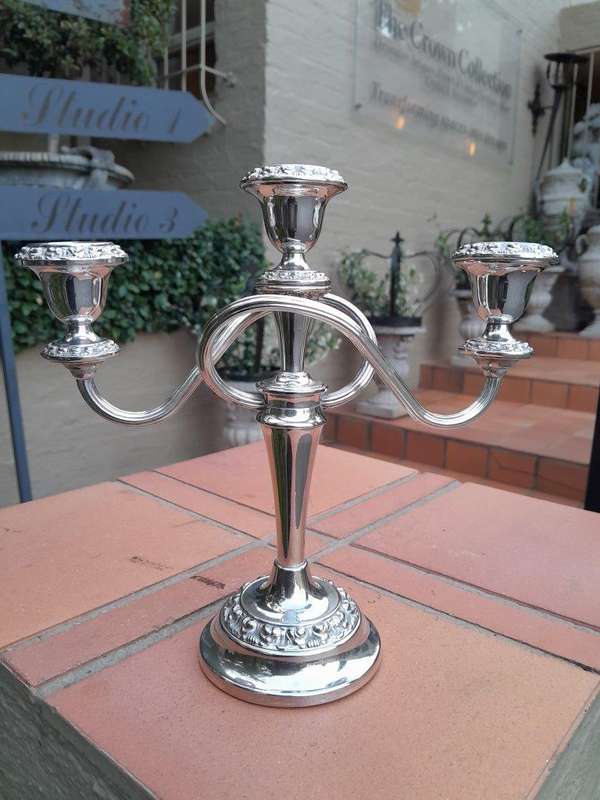 A 20TH Century Pair of Silver Plate Candelabras
