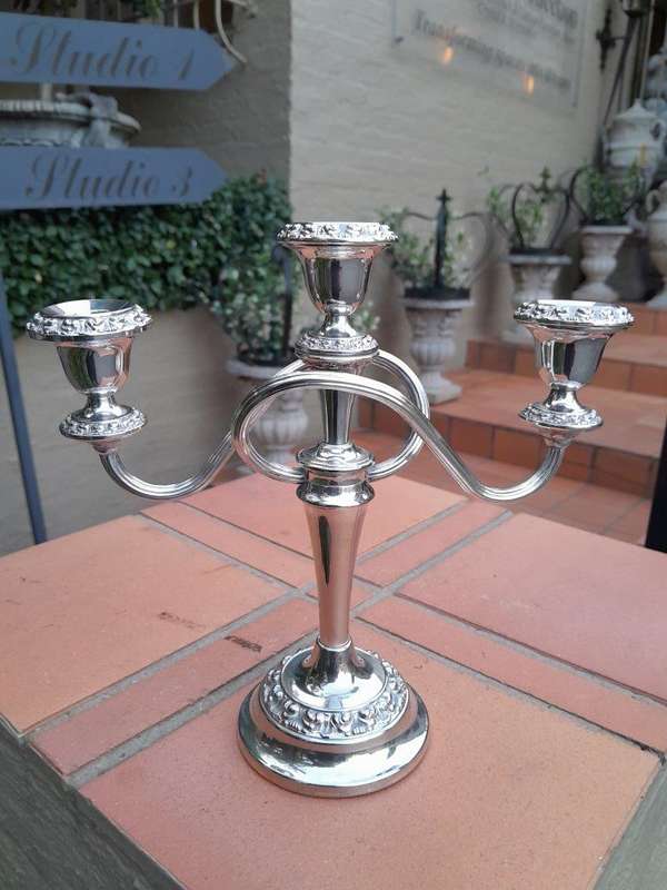 A 20TH Century Pair of Silver Plate Candelabras